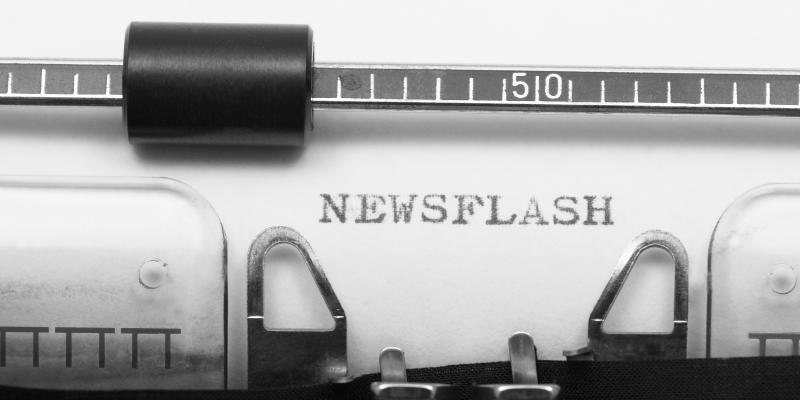 Typewriter typing the word "newsflash"